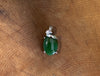 Jade oval pendant with a twist