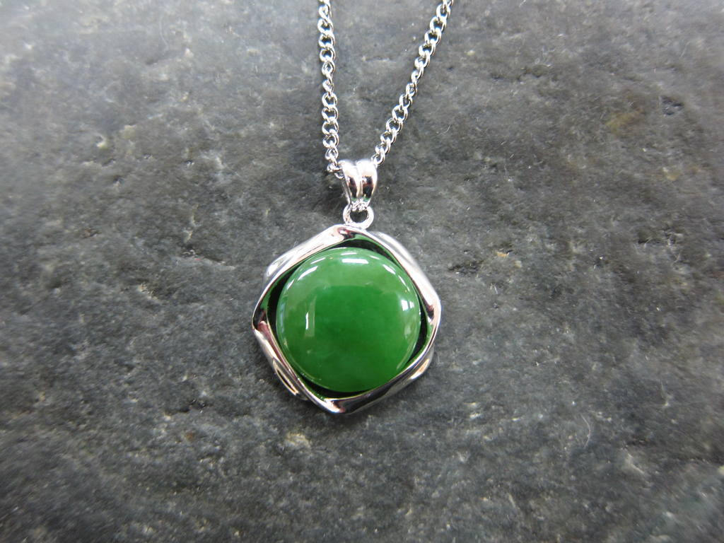 Jade Circle Set in a Sterling Silver Twist